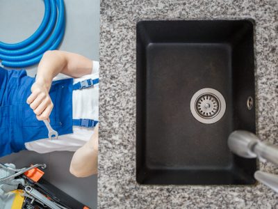 High angle of black kitchen sink and plumber repairing pipes with wrench and equipment on the floor